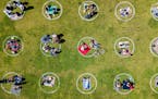 An aerial view shows people gathered inside painted circles on the grass encouraging social distancing at Dolores Park in San Francisco, California on