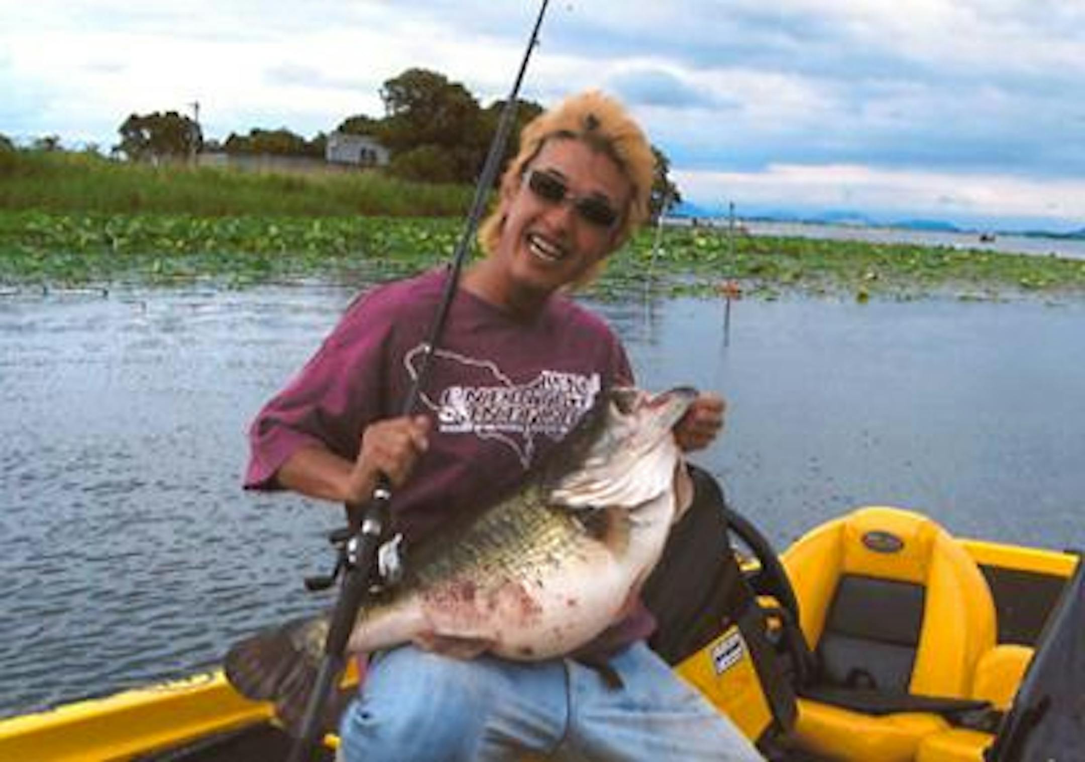 Manabu Kurita and the largemouth bass, reportedly weighing 22-pounds, 4-ounces.