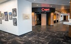 Photographs of Prince performing his first show as a solo artist at the Capri Theater hang in the lobby of the renovated Capri Theater.