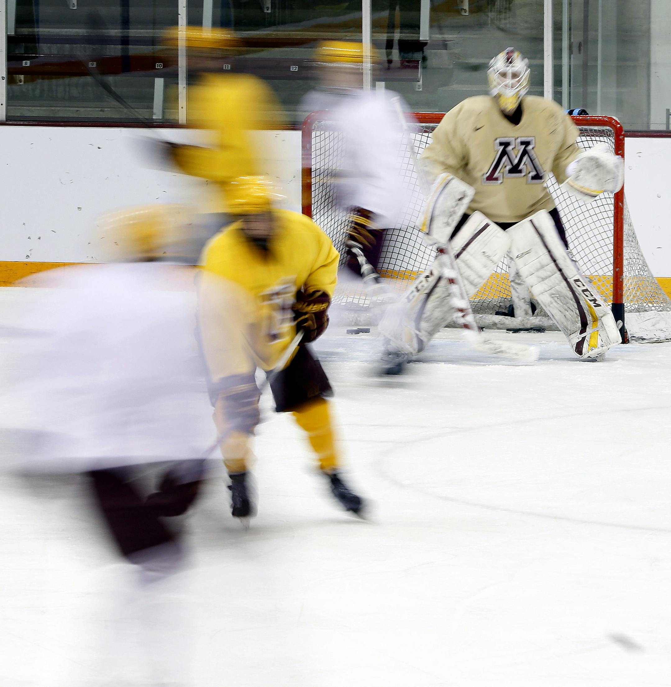 Gophers players during men's hockey practice on Wednesday at Ridder Arena . ] CARLOS GONZALEZ cgonzalez@startribune.com - March 19, 2014 , Minneapolis, Minn., Ridder Arena, Gophers men's hockey Big Ten tournament advance, looking at the speed of the Gophers team.