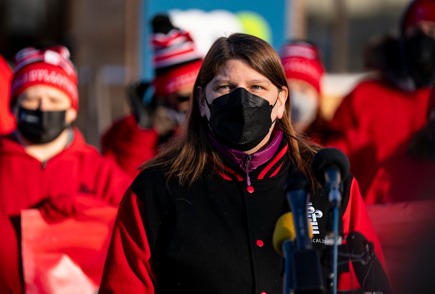 Leah VanDassor, the president of St. Paul Federation of Educators, speaks at a press conference to announce the union's intent to strike Wednesday, Feb. 23, 2022 outside the Bureau of Mediation Services in St. Paul, Minn. ]