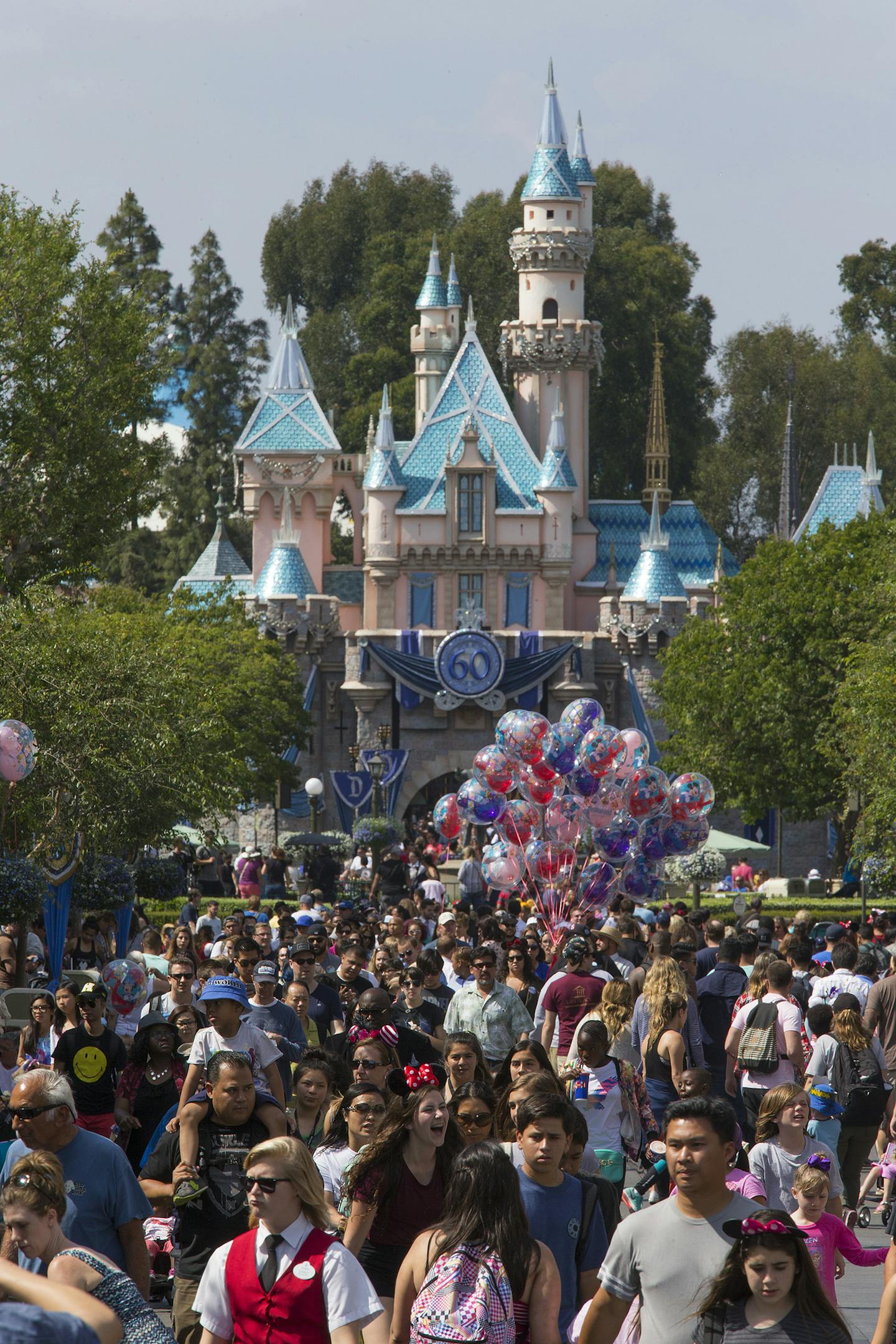 A large crowd strolls down Main Street, U.S.A. during Disneyland's 60th Anniversary Diamond Jubilee in Anaheim, Calif., on June 10, 2015. (Allen J. Schaben/Los Angeles Times/TNS) ORG XMIT: 1171118