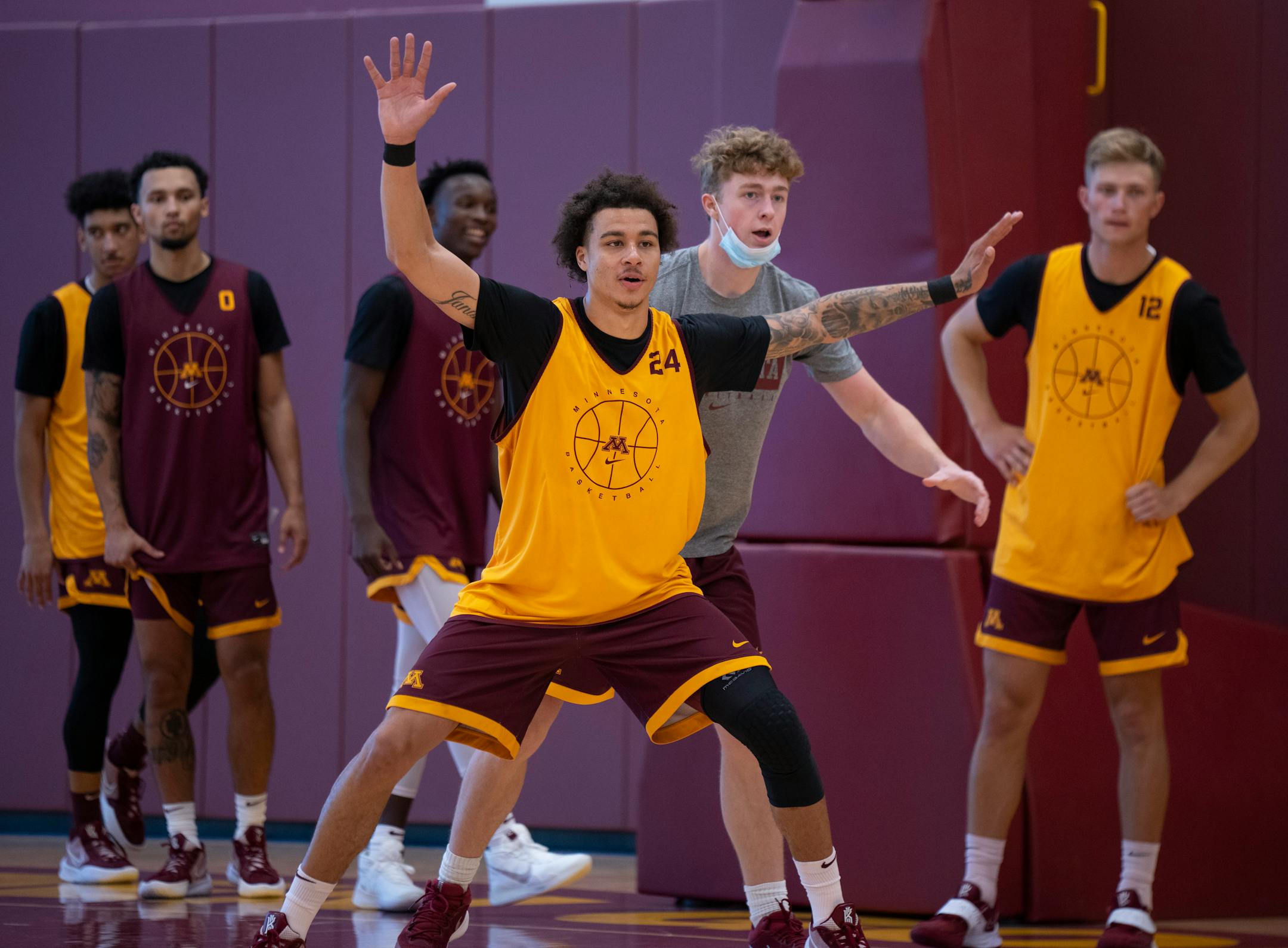 Guard Sean Sutherlin (24) took part in a drill with student manager Jackson Sutherlin during practice Tuesday. ] JEFF WHEELER • jeff.wheeler@startribune.com
