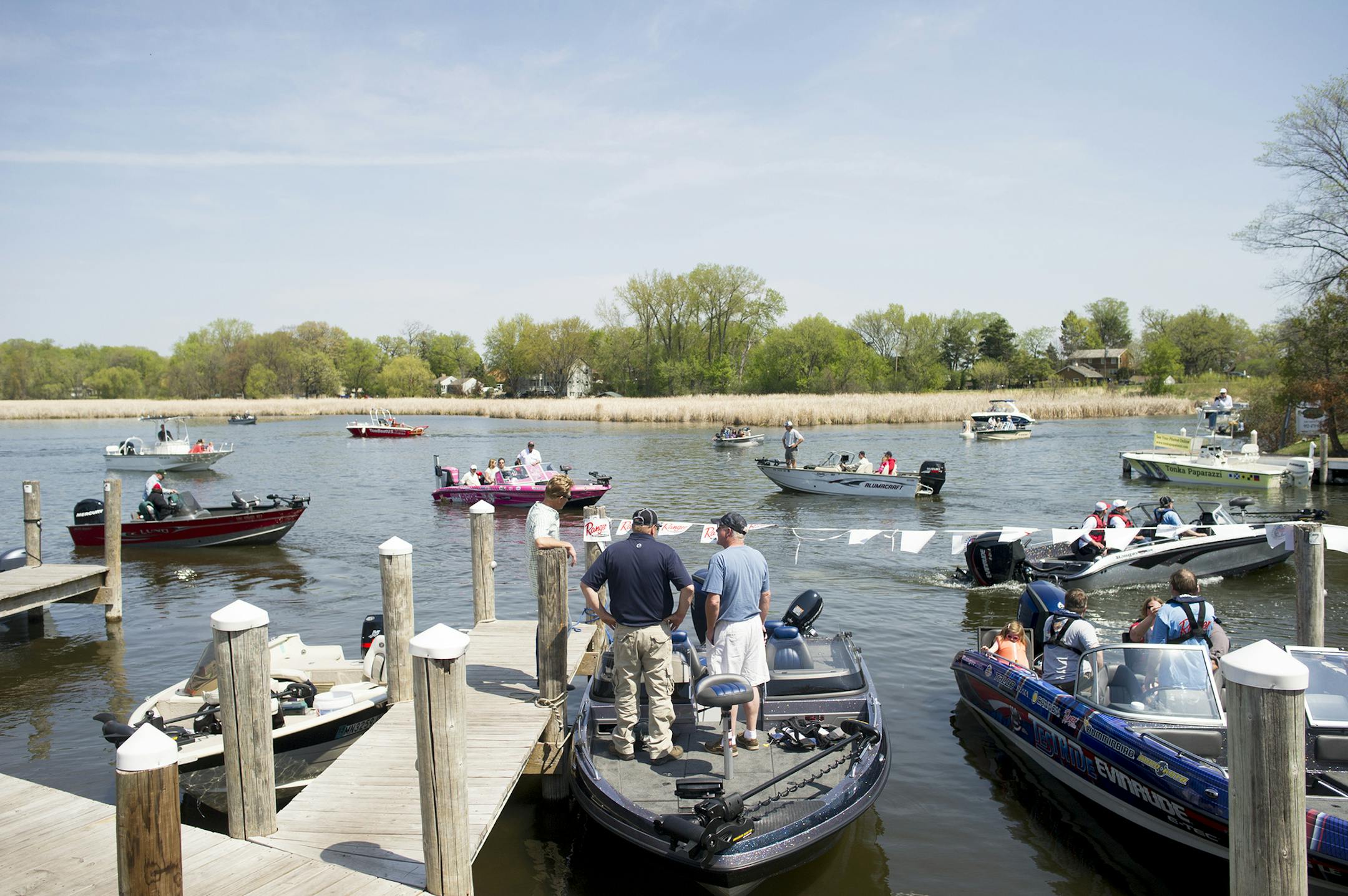 Boats by the dozen descend on Lord Fletcher's docks Saturday, May 2, as contestants in the 2015 Lake Minnetonka Crappie Contest return with their best catches. This year's grand prize, which was awarded in a drawing at the end of the contest, was a 2015 TRACKER Guide V-16 Laker DLX T fishing boat. ] (Matthew Hintz, Orono, 050215)