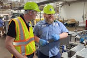 General Mills Chief Supply Chain Officer Paul Gallagher, left, toured the company’s plant in Cedar Rapids, Iowa.