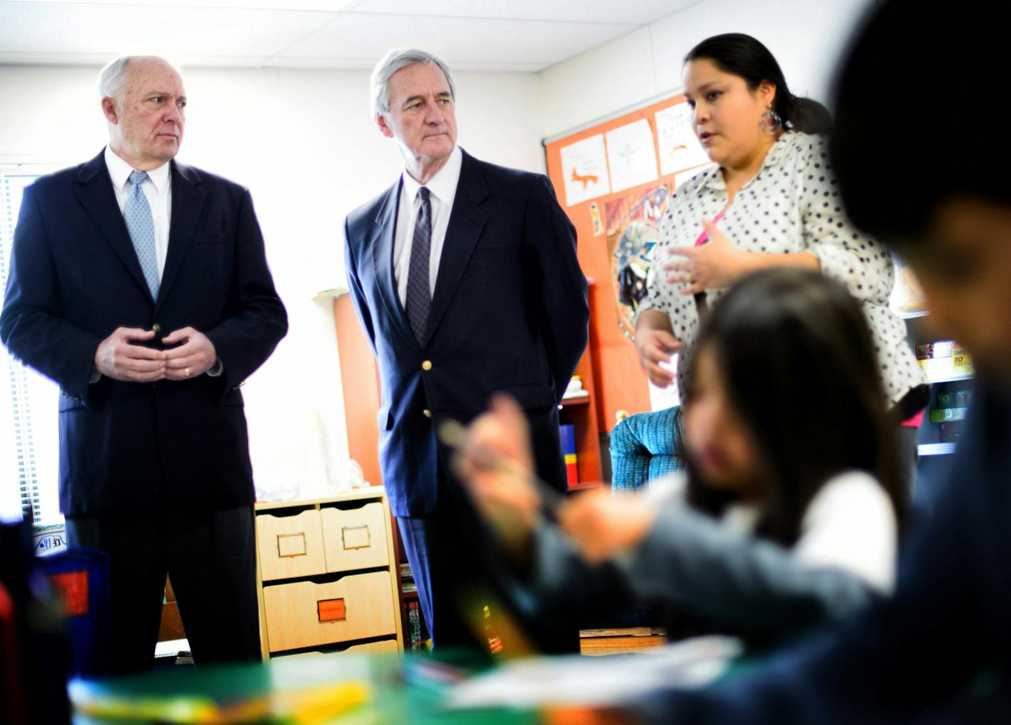 Rep. John Kline and Rep. Rick Nolan listened as first and second grade language teacher Jamie Copenace, right, described the importance of teaching students in the Ojibwe language and how difficult it is to teach in a temporary trailer classroom. ] GLEN STUBBE * gstubbe@startribune.com Wednesday, April 8, 2015 Rep. John Kline and Rep. Rick Nolan visited the Bug-O-Nay-Ge-Shig school run by the Leech Lake Band of Ojibwe to try to drum up support for a federal infusion of needed money into the trou