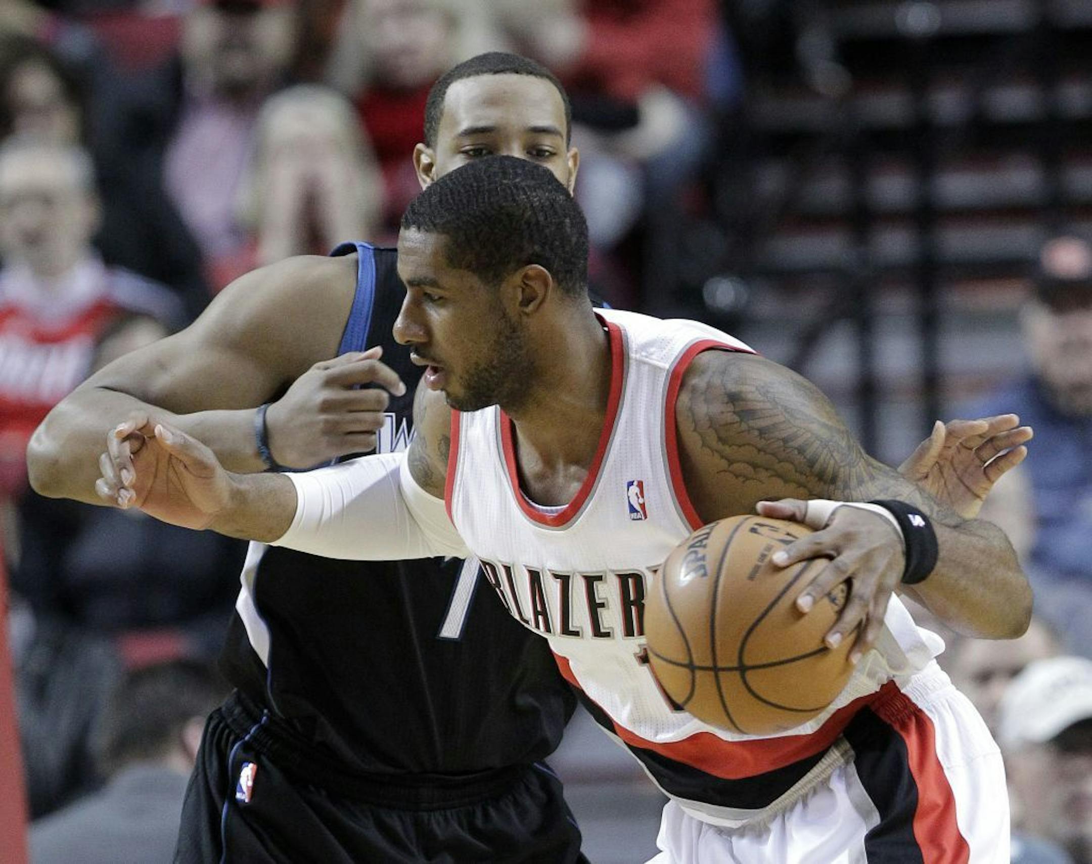 Portland Trail Blazers forward LaMarcus Aldridge works his way inside against Timberwolves forward Derrick Williams
