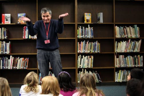 Artist Steve Busa worked with fourth-grade students just before they started on a focusing exercise at Lake Nokomis Community School.