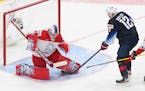 United States' Matthew Boldy watches the puck go in the net past Czech Republic's goalie Lukas Parik on a shot from Arthur Kaliyev during the third pe