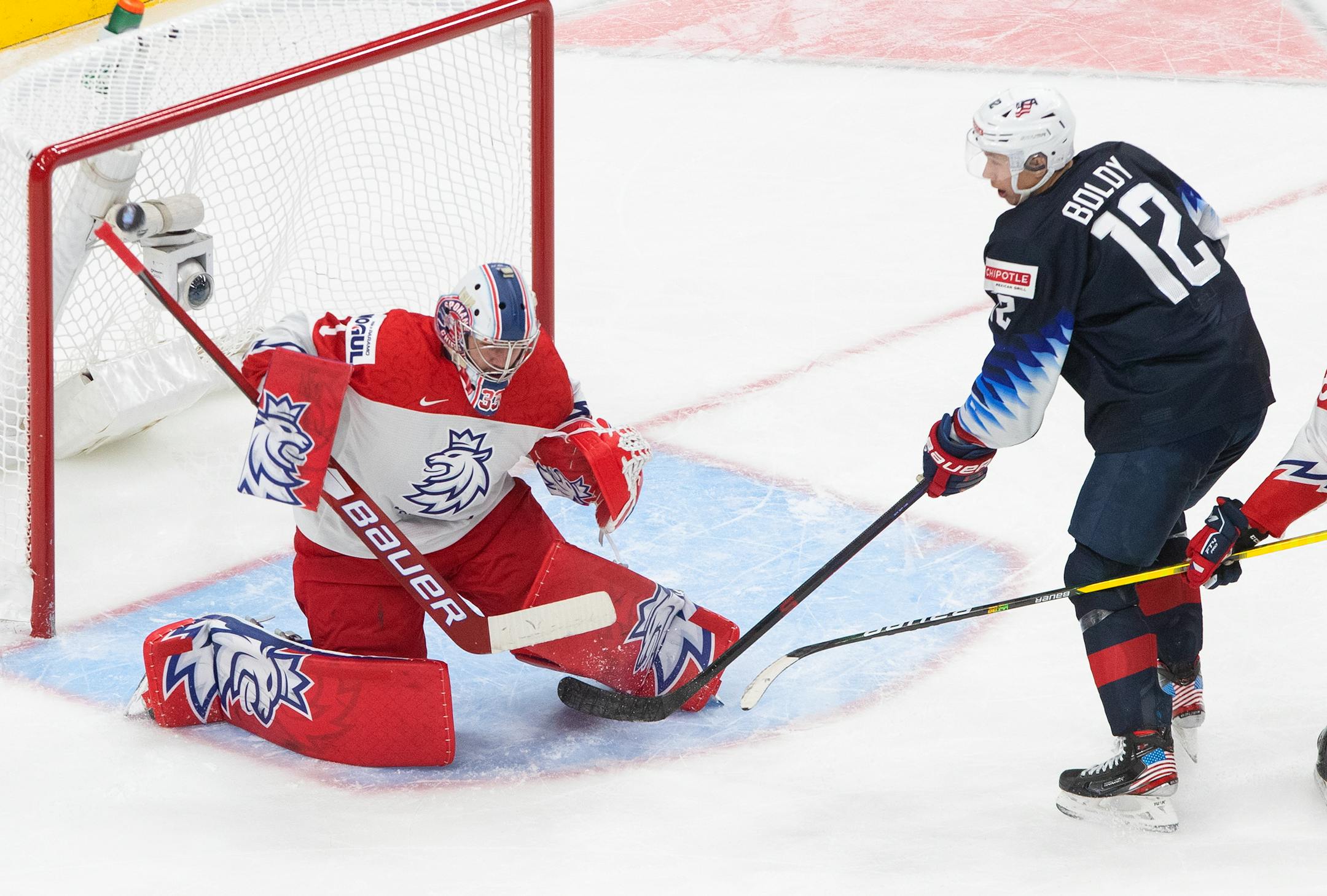 United States' Matthew Boldy watches the puck go in the net past Czech Republic's goalie Lukas Parik on a shot from Arthur Kaliyev during the third period