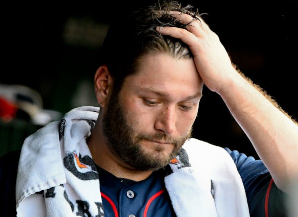 Minnesota Twins starting pitcher Lance Lynn (31) stands in the dugout after being relieved during the second inning of an baseball game against the Ch