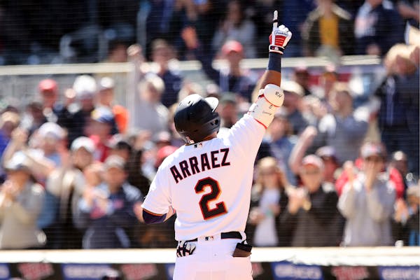 Minnesota Twins Luis Arraez (2) reacts after hitting a home run during the first inning of a baseball game against the Seattle Mariners, Saturday, Apr