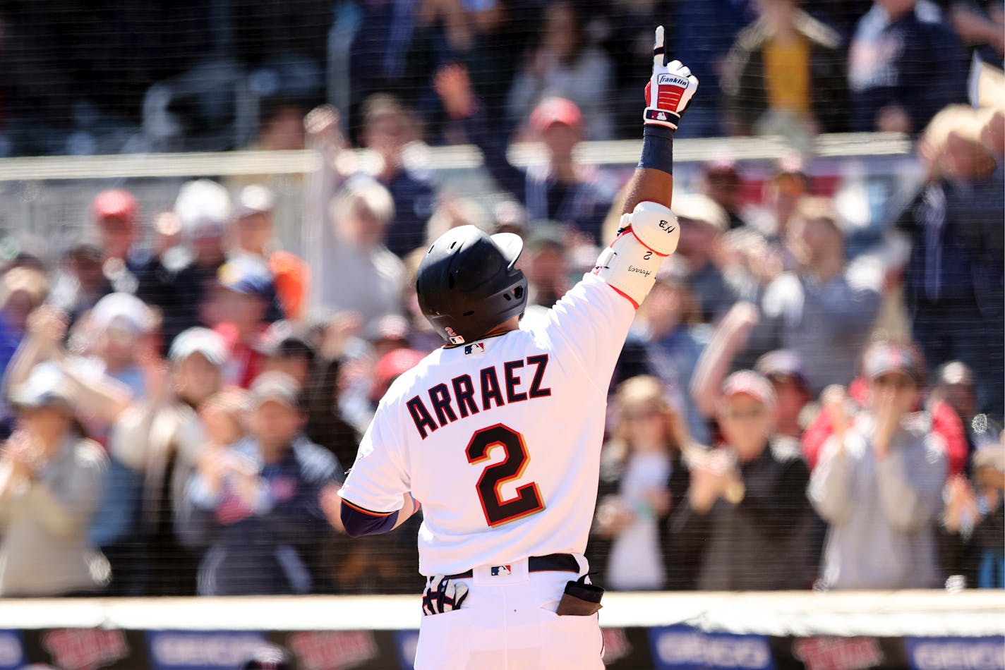 Minnesota Twins Luis Arraez (2) reacts after hitting a home run during the first inning of a baseball game against the Seattle Mariners, Saturday, April 9, 2022, in Minneapolis. (AP Photo/Stacy Bengs)