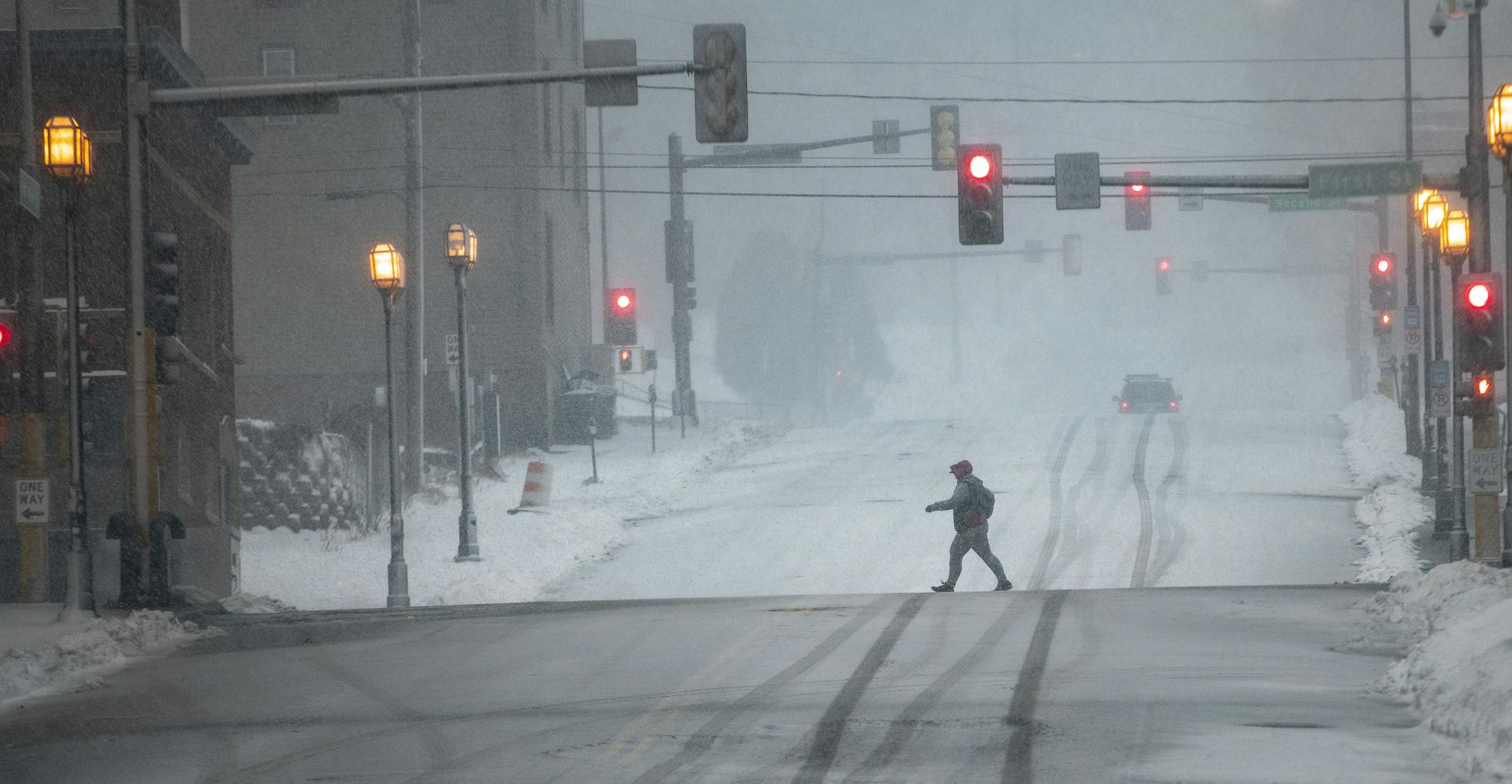 A pedestrian walks along First St. in Duluth, MN during the snow storm on Saturday November 30, 2019. ]
ALEX KORMANN &#x2022; alex.kormann@startribune.com A "historic" storm has hit Duluth, pounding it with gale force winds and 15-24 inches of snow over the next two days.