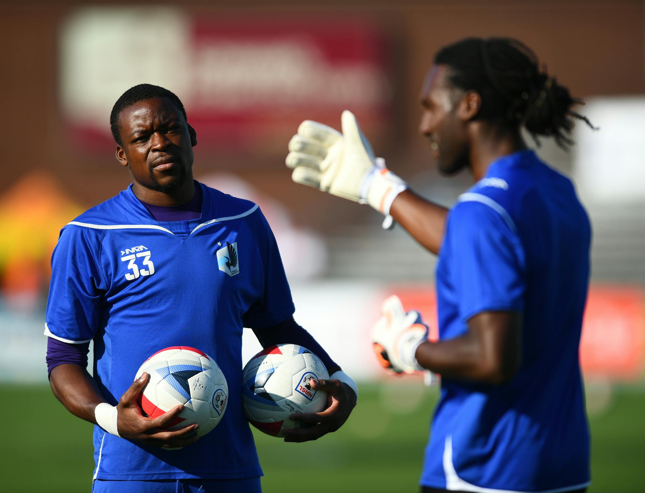Minnesota United FC goalkeeper Steward Ceus (12), right, talked to goalkeeper coach Paul O'Connor, not pictured, as goalkeeper Sammy Ndjock (33) listened in Saturday night. Ndjock, who is on the bench Saturday, allowed four goals including an own goal during Wednesday night's friendly against Bournemouth. His own goal quickly went viral. ] (AARON LAVINSKY/STAR TRIBUNE) aaron.lavinsky@startribune.com Minnesota United FC played the Ft. Lauderdale Strikers on Saturday, July 23, 2016 at the National