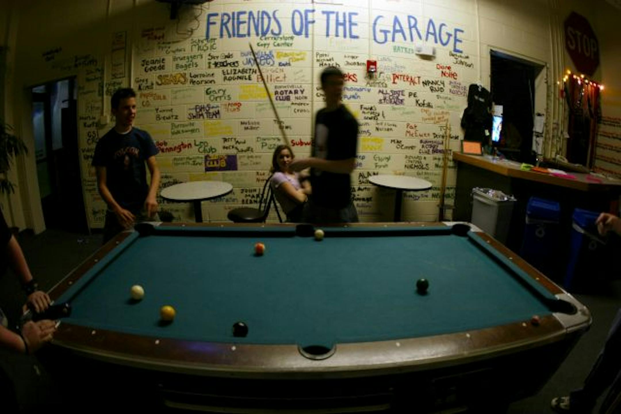 Pool is played in the front room as a band plays to a crowd The Garage in Burnsville last Saturday night.