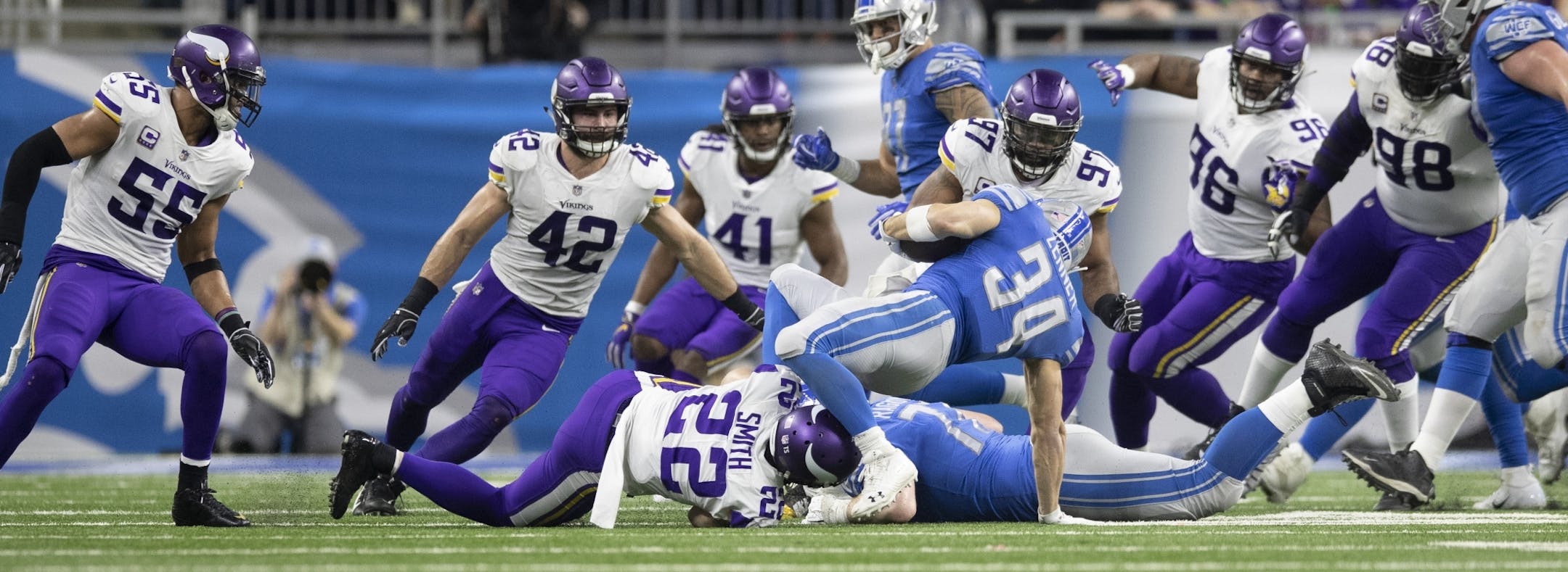 Detroit Lions running back Zach Zenner (34) was stopped for now gain by a host of Vikings defenders in the first quarter at Ford Field Sunday December 23, 2018 in Detroit, MI.