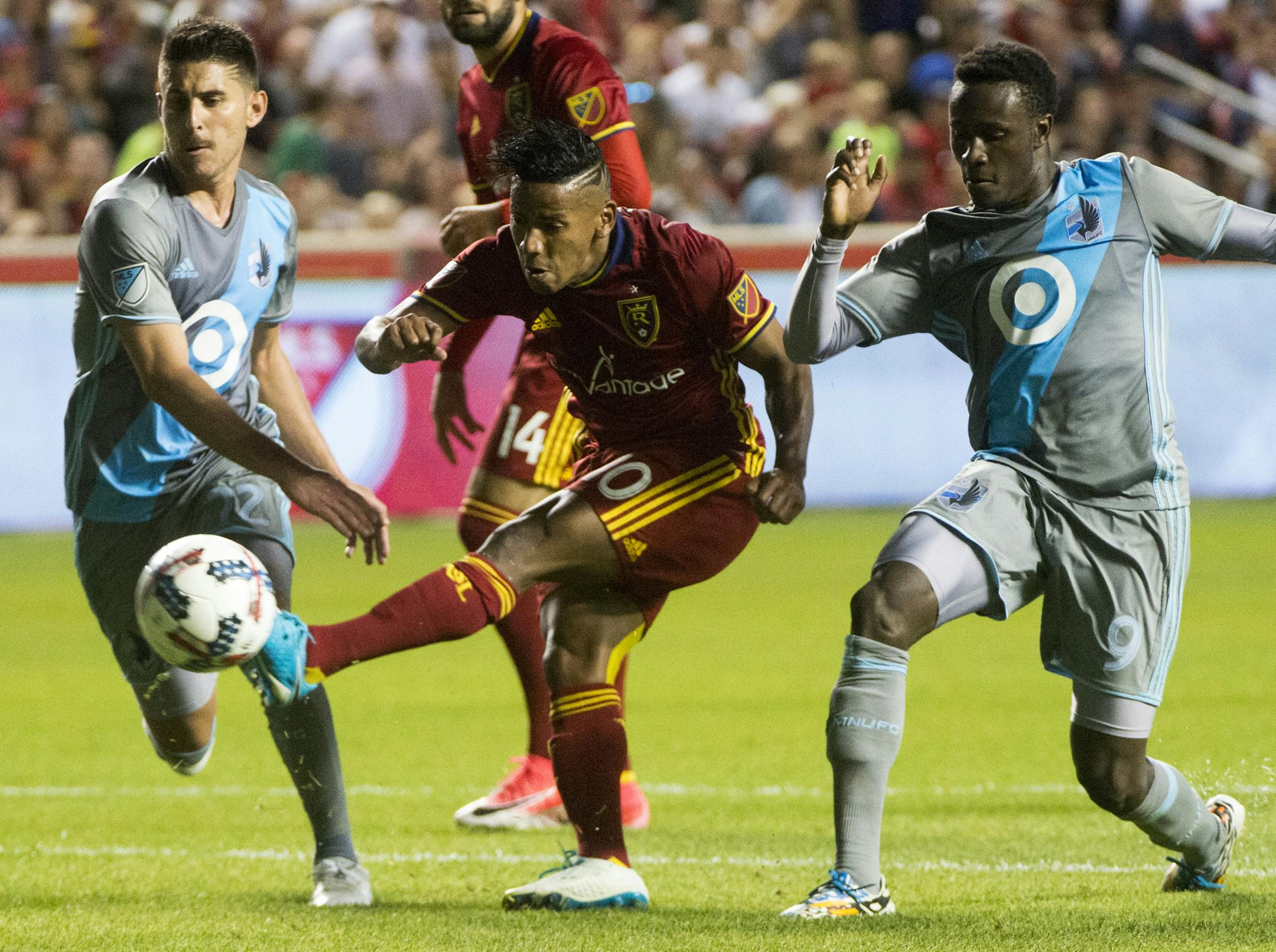Real Salt Lake forward Joao Plata got the ball past Minnesota United defender Kevin Venegas, left, and forward Abu Danladi (9) during a match in Sandy, Utah, on Saturday.