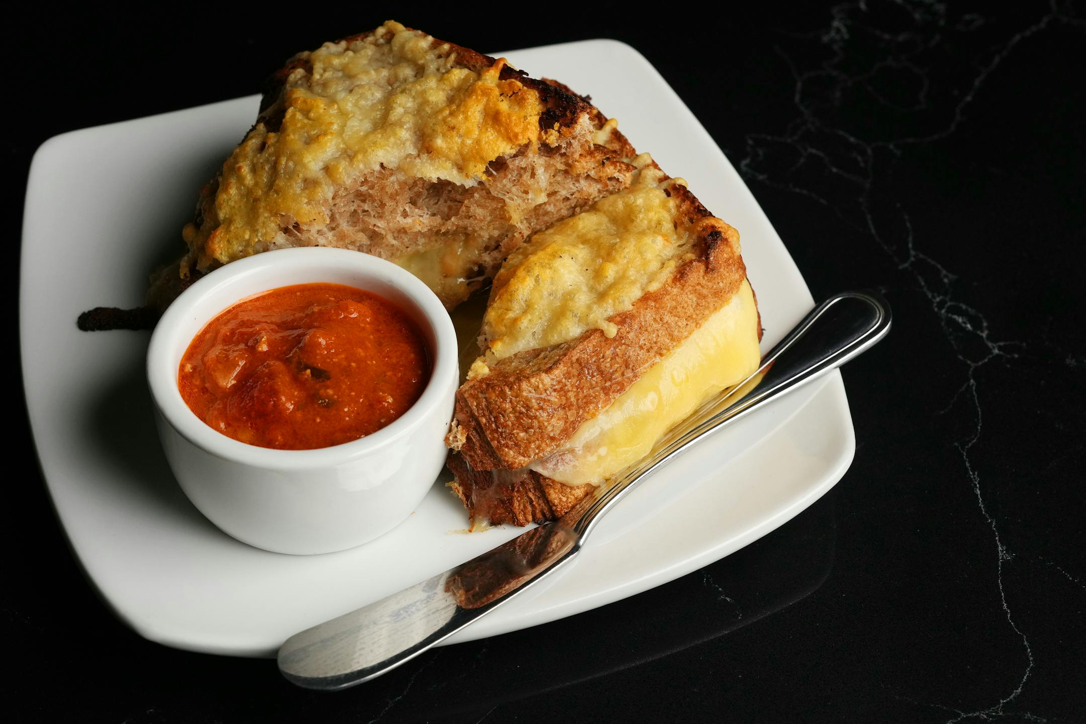 The 3-cheese toasted sandwich at Backstory Coffee.