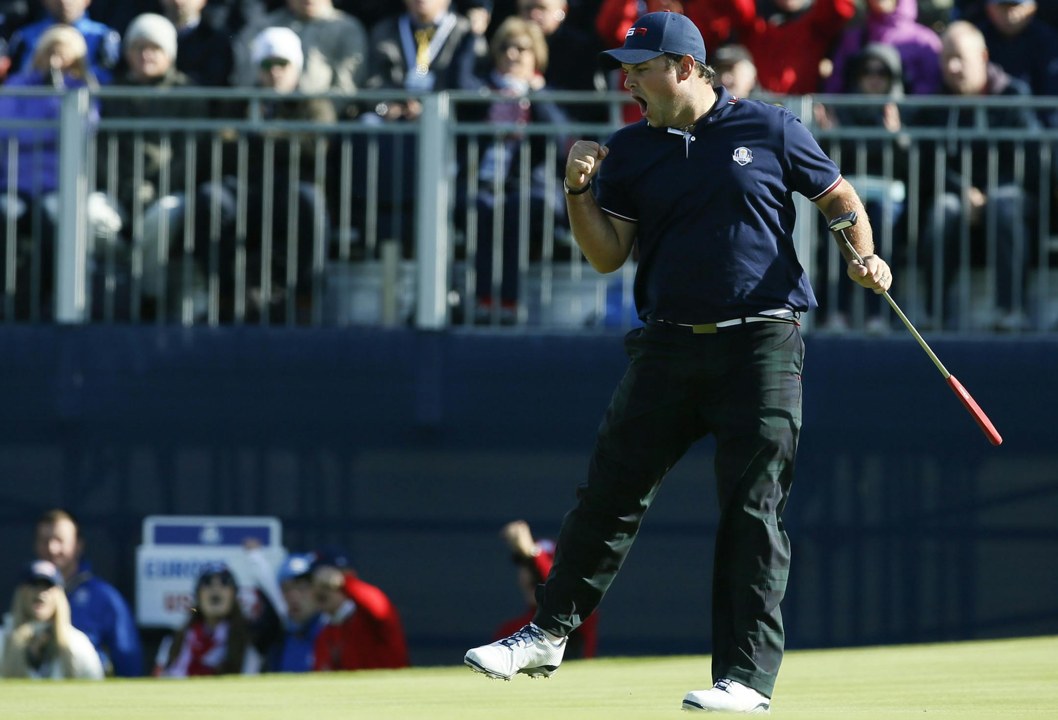 Patrick Reed of the US celebrate putting to win the 13th green during the fourball match on the second day of the Ryder Cup golf tournament at Gleneagles, Scotland, Saturday, Sept. 27, 2014. (AP Photo/Alastair Grant) ORG XMIT: RCUP323