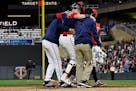 Twins catcher Mitch Garver was helped off the field after he was injured tagging out the Angels' Shohei Ohtani in the eighth inning Tuesday night. Gar