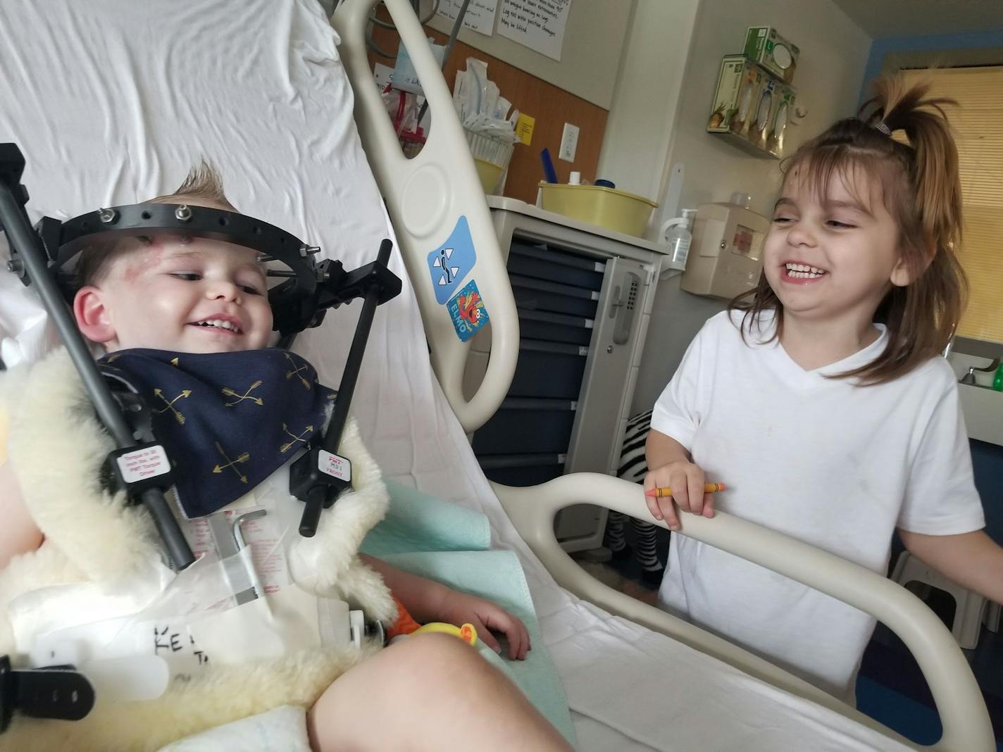 Lillianna and Kayden Peltier share a smile. Last month the children were struck by a driver who was fleeing police and careened into the Minneapolis playground where they and their siblings were playing. Three of the Peltiers' seven children were seriously injured.