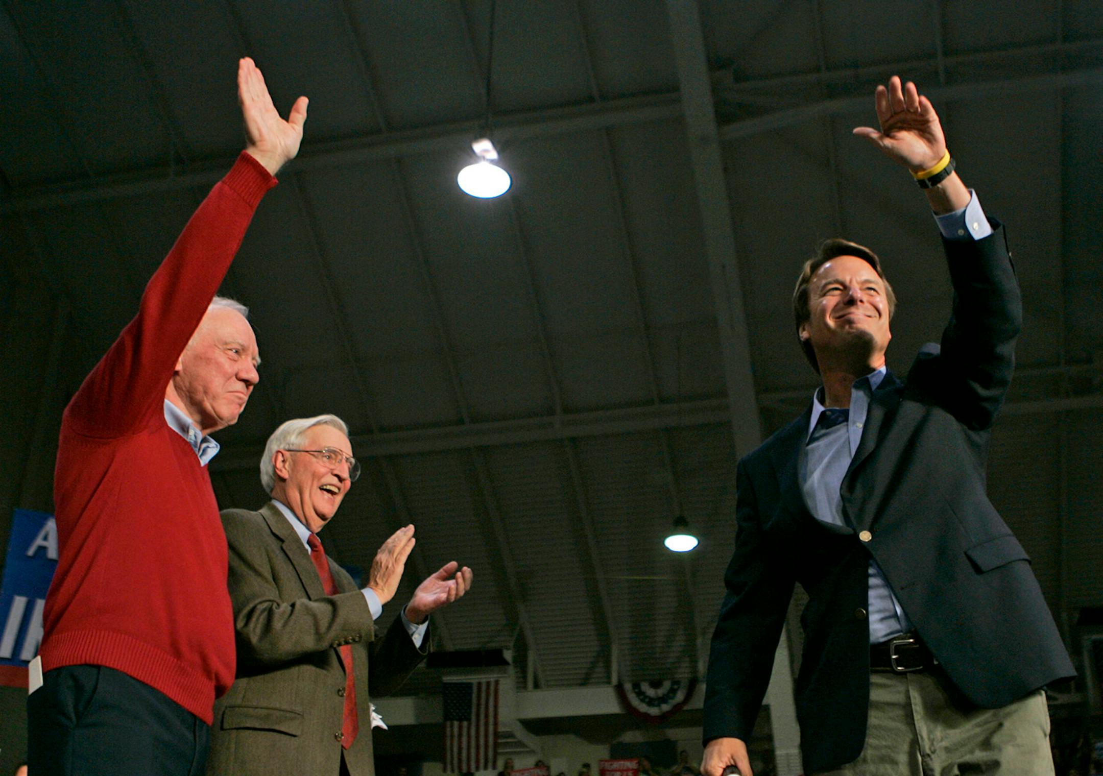 Staff photo by Jeff Wheeler
HIBBING - 10/19/04 - Vice Presidential candidate Sen. John Edwards addressed a campaign rally at the Hibbing Memorial Arena Tuesday night in Hibbing. The last candidates to hold rallys in the building where Harry Truman and John Kennedy, who both went on to win the presidency.
IN THIS PHOTO: Sen. John Edwards waves to crowd after he was introduced by congressman Jim Oberstar, left, and former Vice President Walter Mondale.