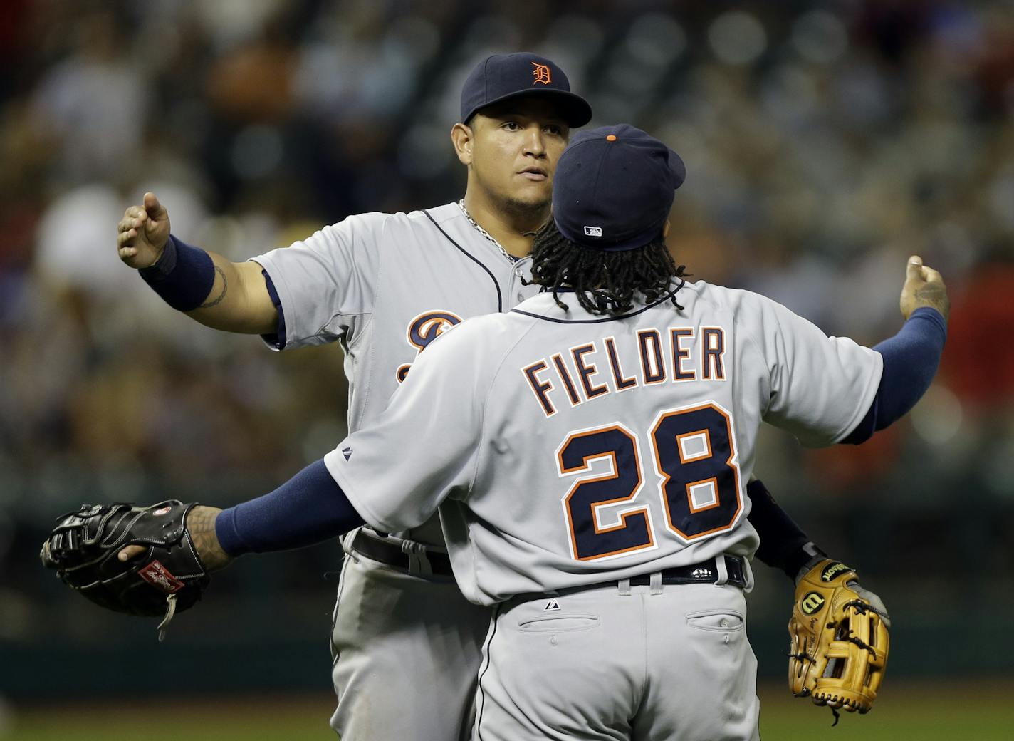 Detroit Tigers' Miguel Cabrera and Prince Fielder (28) celebrate after a 7-0 win over the Cleveland Indians in a baseball game on Friday, July 5, 2013, in Cleveland. (AP Photo/Mark Duncan)