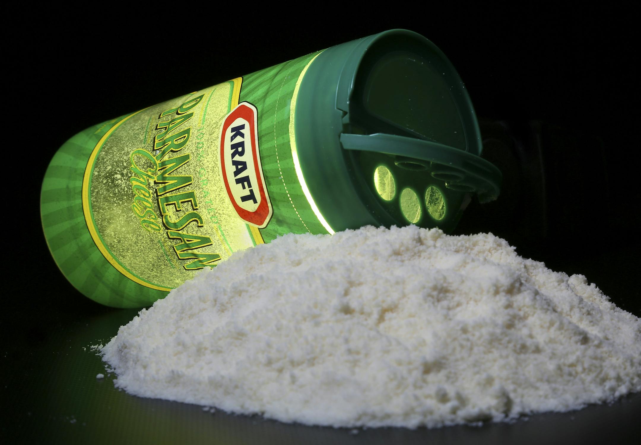 A package of Kraft parmesan cheese is seen in Washington, Tuesday, March 11, 2014. Looking for American-made parmesan cheese on the grocery aisle? If the European Union gets its way, you may not be able to find it. Also missing could be domestic asiago, feta and gorgonzola. The cheeses would still be there, but their names might be different. As part of free trade talks, the European Union is expected to propose to ban the United States from using certain European cheese names if the cheese is m