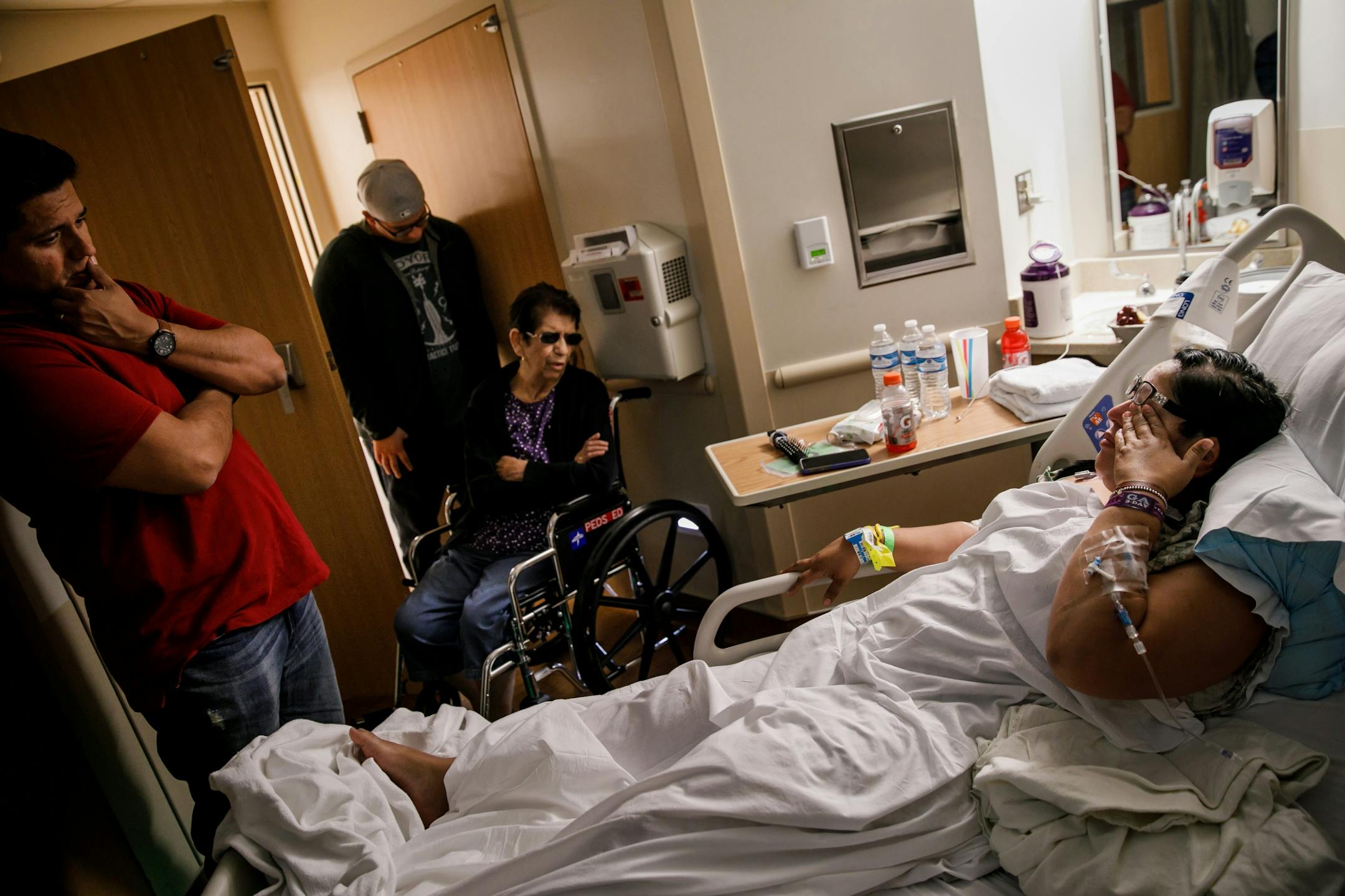 With the presence of her family, Danny Alegria, from left, Evan Algeria and Lucy Alegria - Carmen Alegria recounts her harrowing experience surviving and escaping the mass shooting that killed 59 and injured more than 525 at the Route 91 Harvest Festival, in Las Vegas, Nevada, on Oct. 2, 2017.