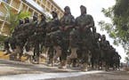 Somali women military soldiers march during celebrations marking the 57th anniversary since the force was founded in Mogadishu, Somalia, Wednesday, Ap