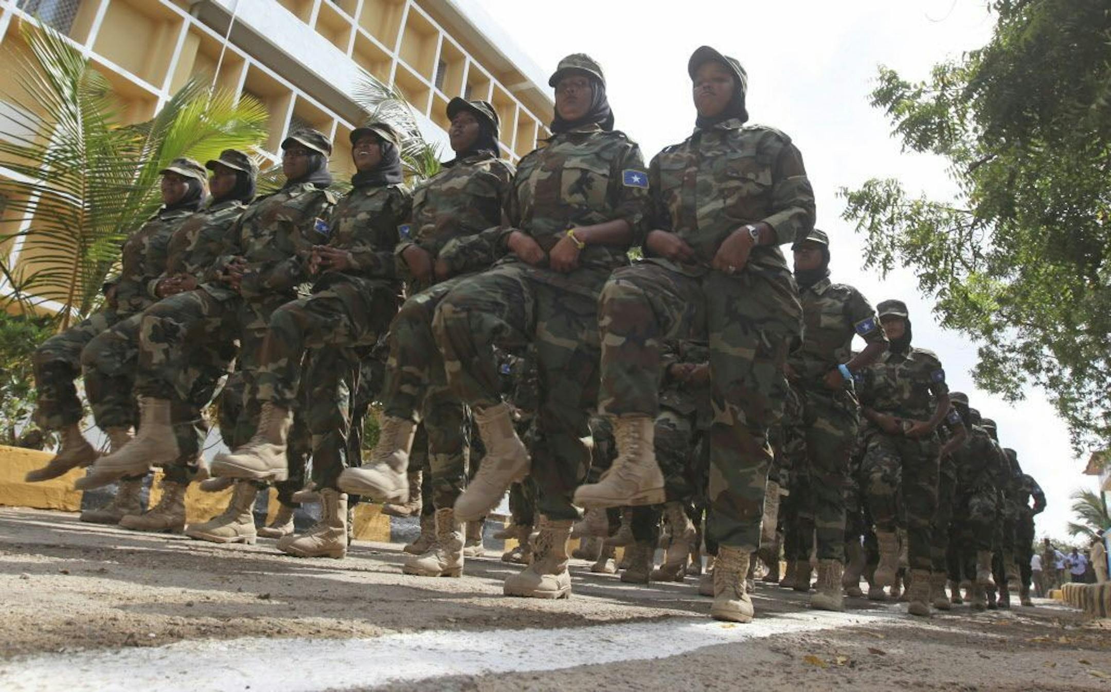 Somali women military soldiers march during celebrations marking the 57th anniversary since the force was founded in Mogadishu, Somalia, Wednesday, April 12, 2017.