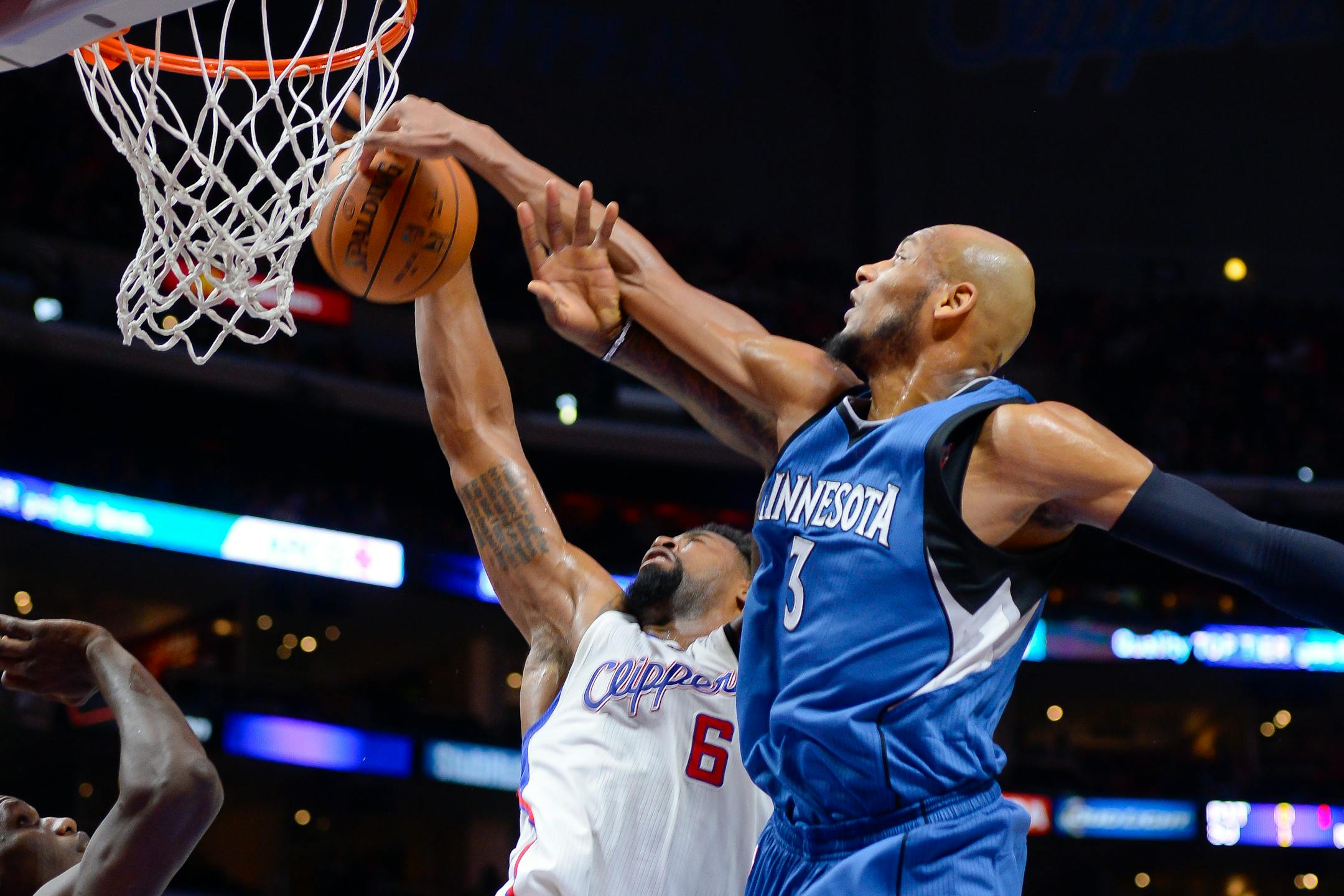 Minnesota Timberwolves forward Adreian Payne (3) and Los Angeles Clippers center DeAndre Jordan (6) battle for rebound in the first half of an NBA basketball game, Monday, March 9, 2015, in Los Angeles.(AP Photo/Gus Ruelas)