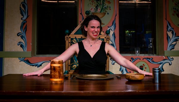 Isabel Nelson invites audiences to a “Feast,” a Walking Shadow production at the Black Forest Inn. The show runs through April 1.