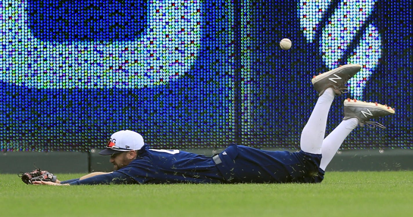 A ball hit by Kansas City Royals' Alex Gordon gets past Minnesota Twins right fielder Jake Cave during the seventh inning of a baseball game at Kauffman Stadium in Kansas City, Mo., Sunday, June 23, 2019. Gordon doubled on the play. (AP Photo/Orlin Wagner)