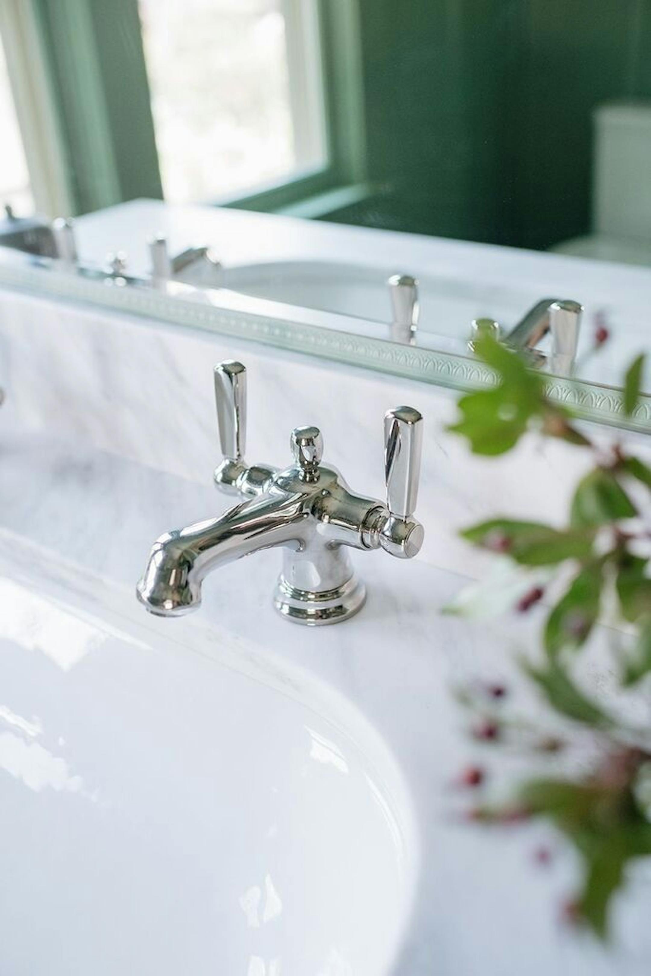 The vanity has a Carrara marble top.