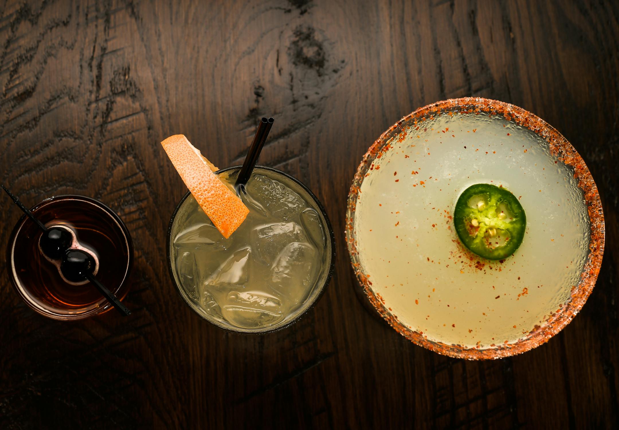 Mezcal-based cocktails offered at Baja Haus include, from left, the 2 Gringo 1 Chino, the Paloma Smokeshow and the Bad Hombre.