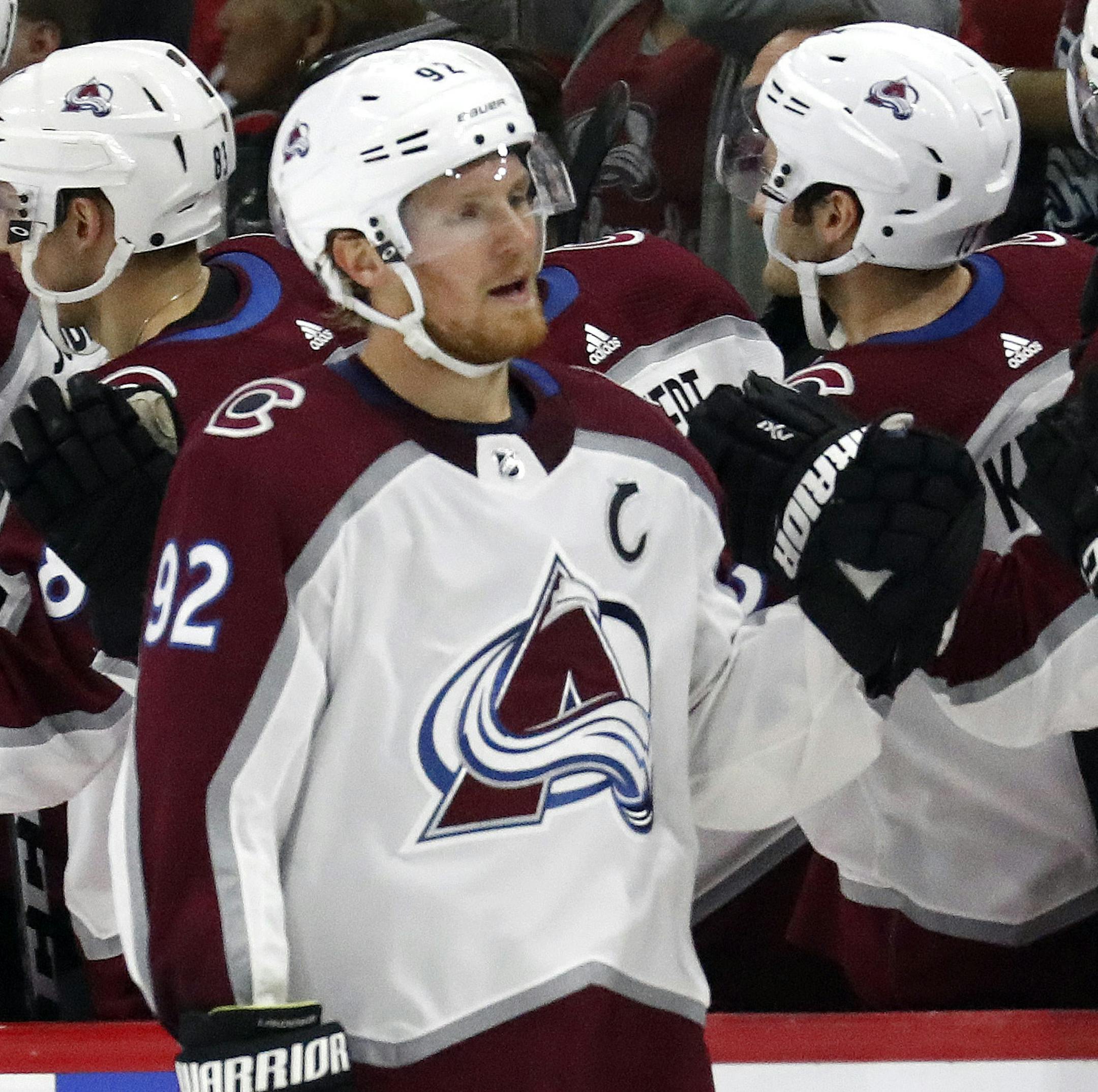 Colorado Avalanche's Gabriel Landeskog (92), of Sweden, celebrates his goal with his teammates during the second period of an NHL hockey game in Raleigh, N.C., Saturday, Oct. 20, 2018. (AP Photo/Chris Seward)