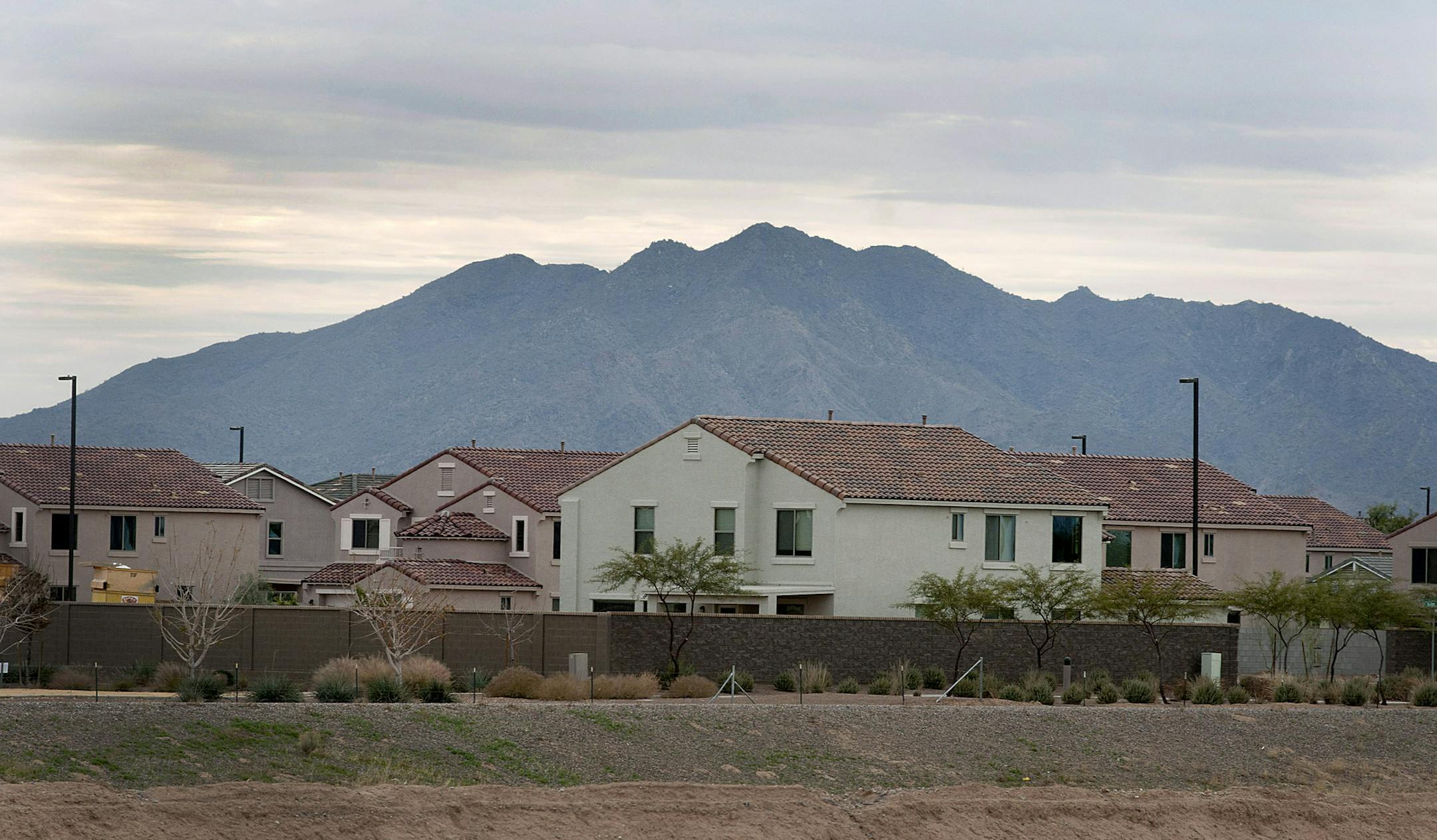 The Blanford Homes LLC Power Ranch community stands in Gilbert, Arizona, U.S., on Thursday, Jan. 12, 2012. The Phoenix housing market, down 55 percent from peak values with more than two-thirds of homeowners owing more than their properties are worth, is starting to recover as demand grows and inventory shrinks. Photographer: Laura Segall/Bloomberg ORG XMIT: 137420392