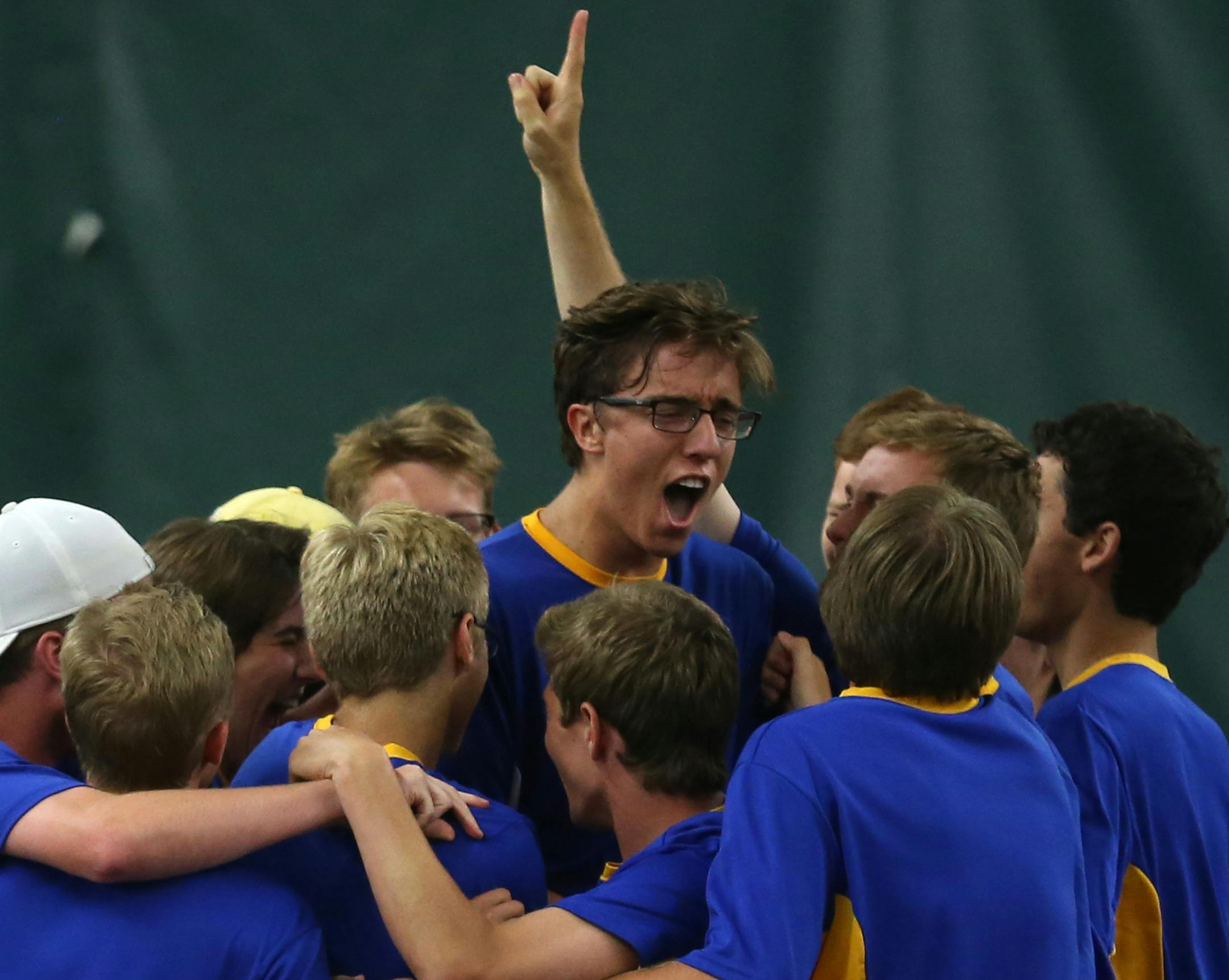 Wayzata celebrated with teammate Jake Strom after he and Steele Kowalczyk won the doubles match winning the state tournament. ] (KYNDELL HARKNESS/STAR TRIBUNE) kyndell.harkness@startribune.com Boys' tennis state team finals match, Class 2A Wayzata vs Minnetonka at the University of Minnesota at Baseline Tennis Center in Minneapolis, Min. Wednesday, June 4, 2014.