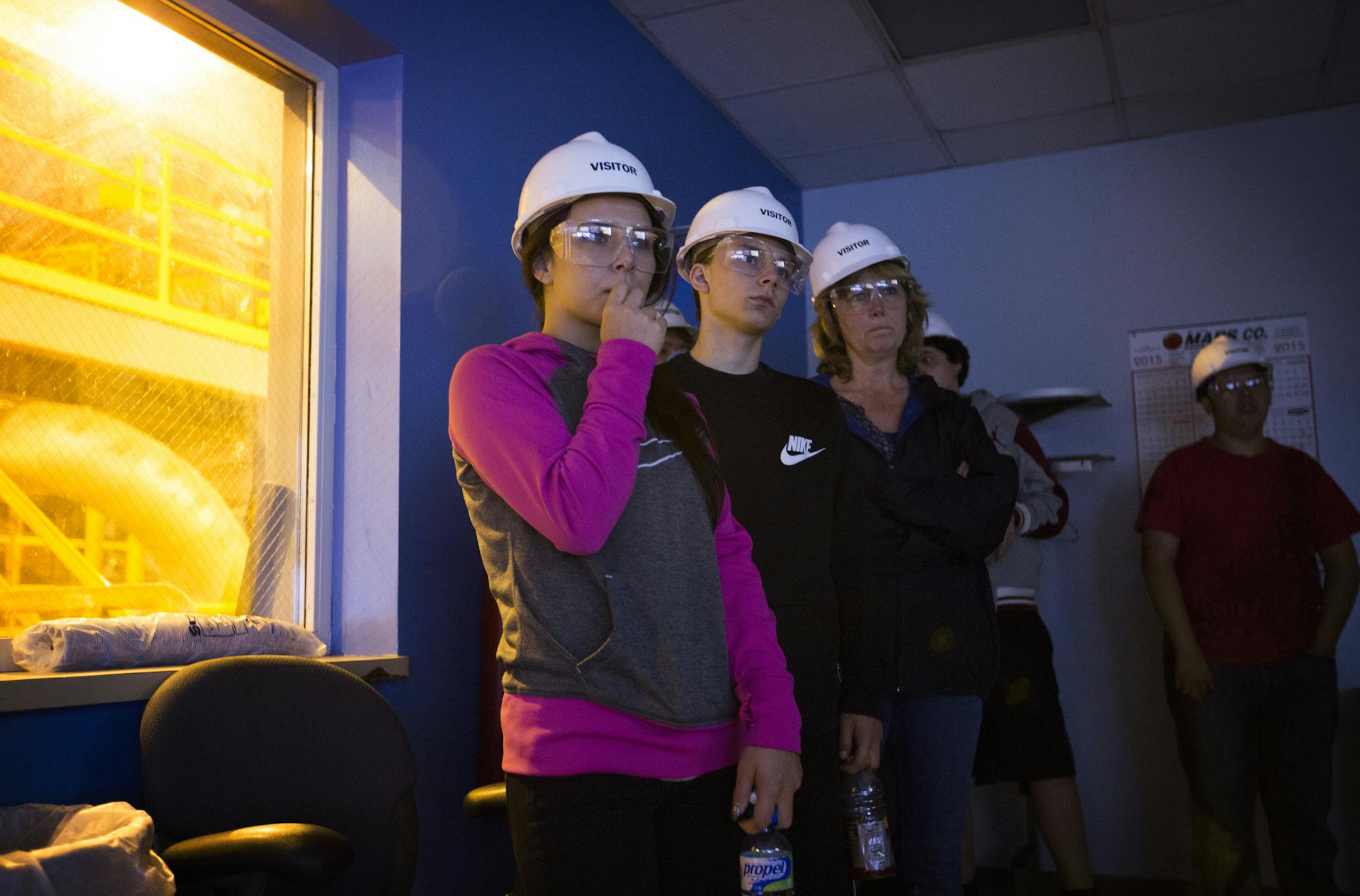 Raelee Larsen (left) and her brother Javin Larsen (second from left), students from Redwood Area School in Redwood Falls, toured Great River Energy’s Elk River Resource Processing Plant in Elk River.