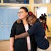 Catrice O'Neal, the director of Out of School Time programs, gets a spontaneous hug from Ebonie Kennedy, 10.