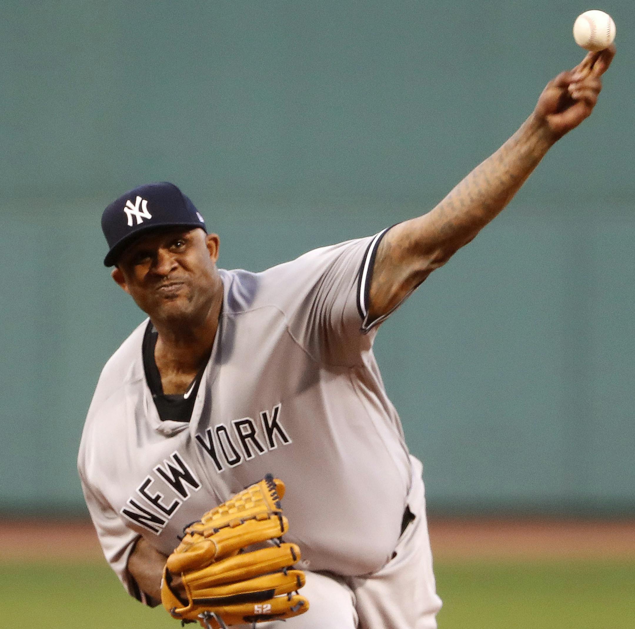 New York Yankees starting pitcher CC Sabathia delivers against the Boston Red Sox during the first inning of a baseball game at Fenway Park in Boston Saturday, Aug. 19, 2017. (AP Photo/Winslow Townson)