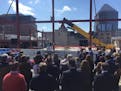 St. Paul Mayor Chris Coleman celebrates the redevelopment of Treasure Island Center, which will have a rooftop Wild training rink, in downtown St. Pau