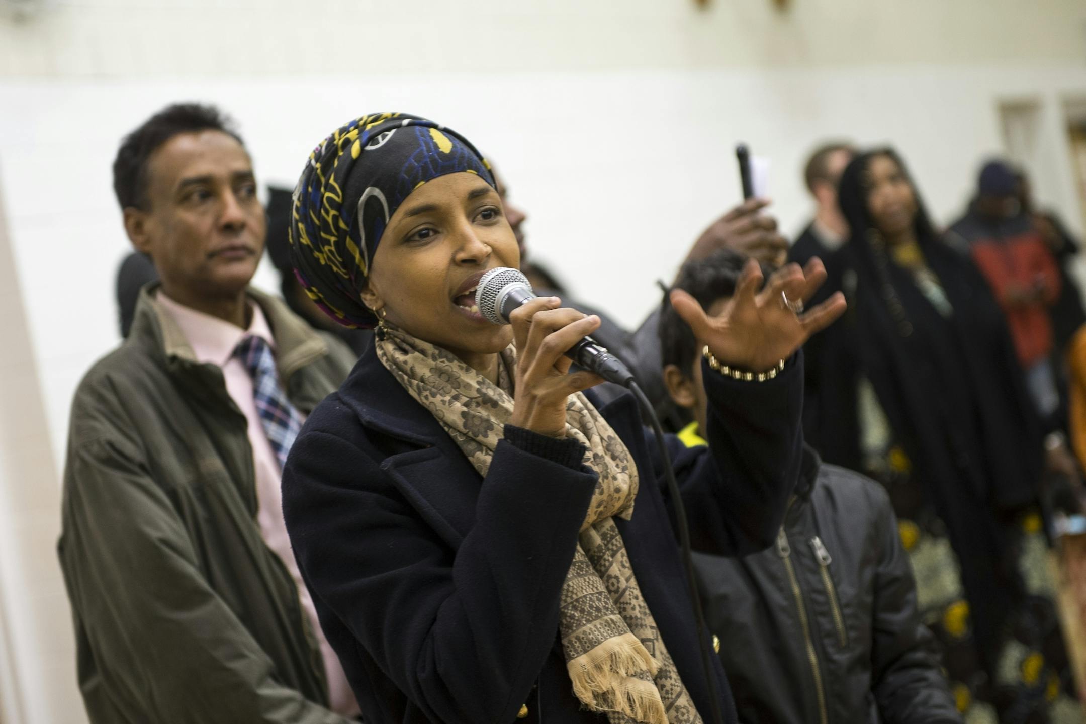 District 60B State Representative Candidate Ilhan Omar addressed the caucus Tuesday night at the Brian Coyle Center in Minneapolis.