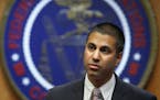 FILE - In this Dec. 14, 2017, file photo, Federal Communications Commission Chairman Ajit Pai arrives for an FCC meeting on net neutrality, in Washing