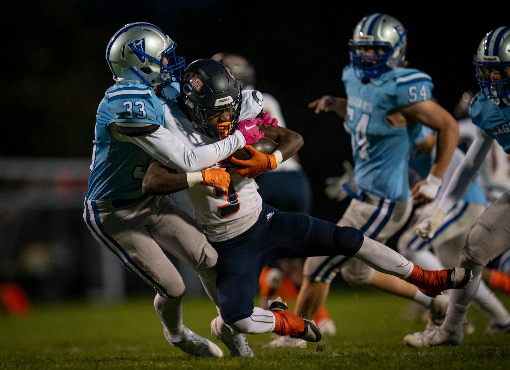 Bloomington Jefferson defensive back Tevin Ekse (33) tackled Robbinsdale Cooper running back Tony Kollie (33) on Friday.