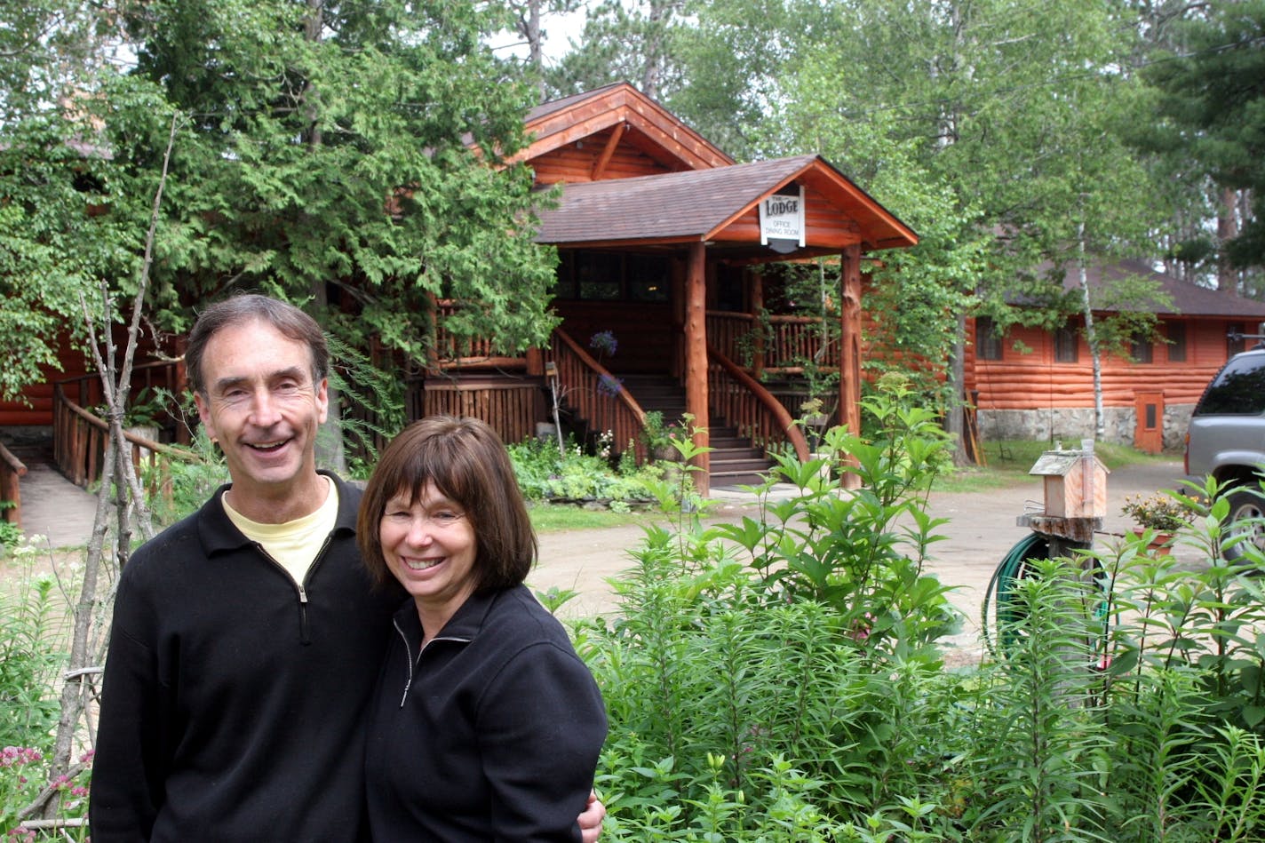 Owners Lou and Lonnie LaMontagne outside the main building of Burntside Lodge.