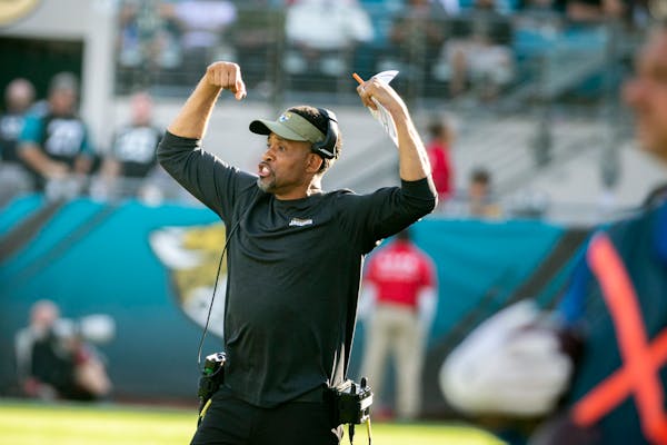 FILE - Then-Jacksonville Jaguars wide receivers coach Keenan McCardell signals from the sideline during the second half of an NFL football game agains