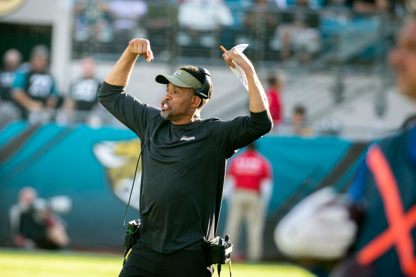 FILE - Then-Jacksonville Jaguars wide receivers coach Keenan McCardell signals from the sideline during the second half of an NFL football game against the Tampa Bay Buccaneers in Jacksonville, in this Sunday, Dec. 1, 2019, file photo. The Minnesota Vikings hired Keenan McCardell as wide receivers coach after he was not retained by new Jacksonville head coach Urban Meyer. (AP Photo/Stephen B. Morton, File)